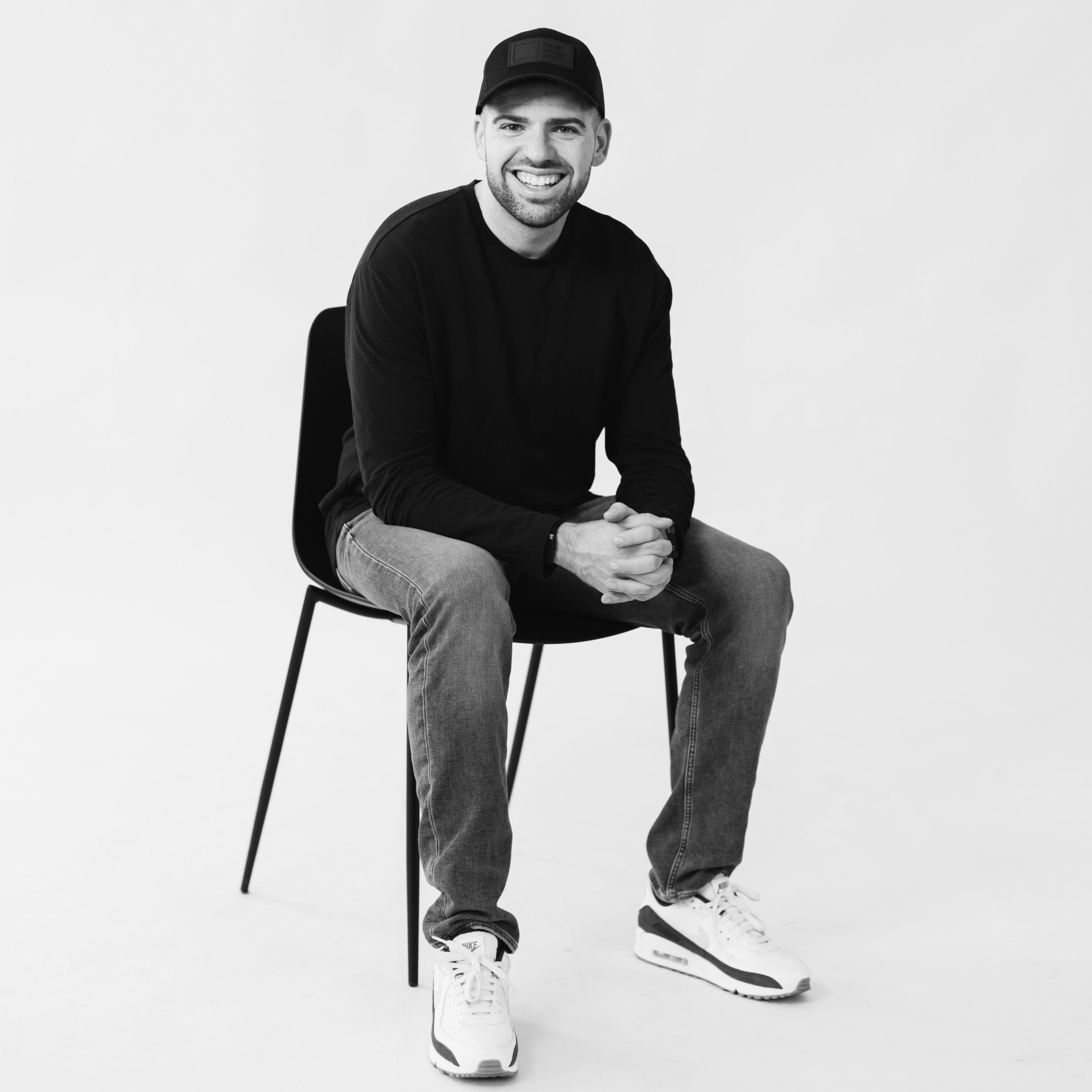 Drew english sitting in a chair for a headhost